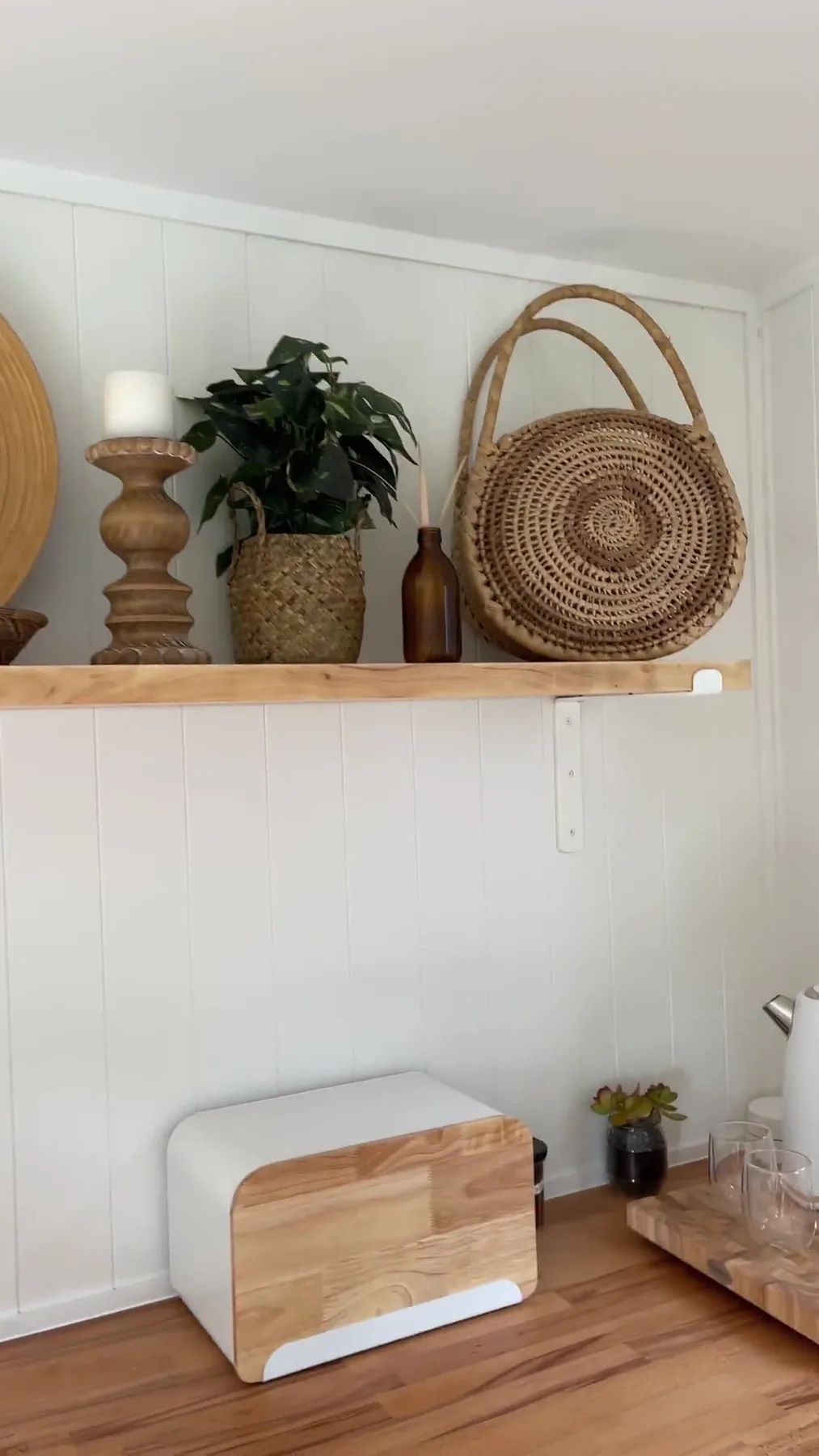 Interior shelf detail with woven baskets and timber trim