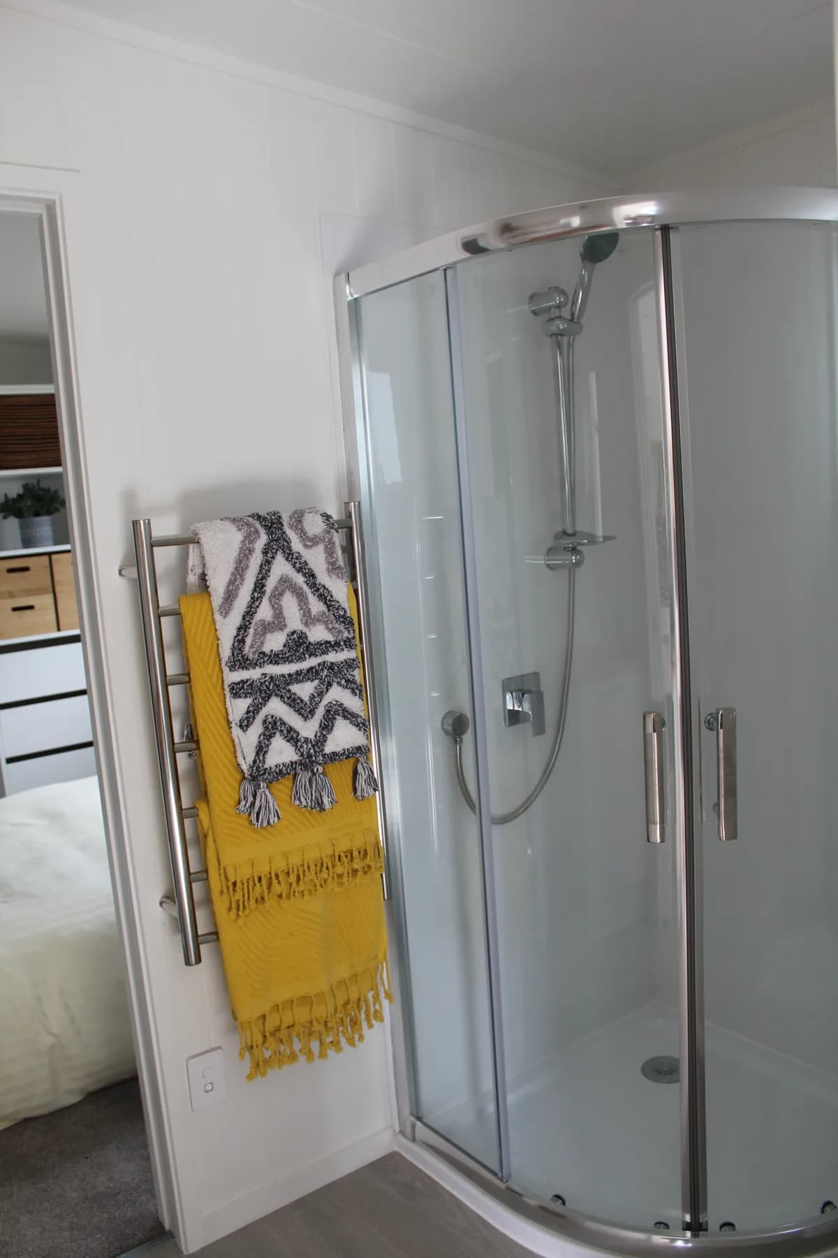 Close-up of the moulded shower unit and glass door before installation
